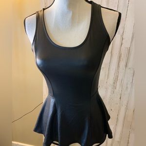 Kira leather looking tank with flared bottom. Size Small.